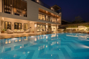 StayVista at The Amaryllis with Heated Pool & Projector Set-Up